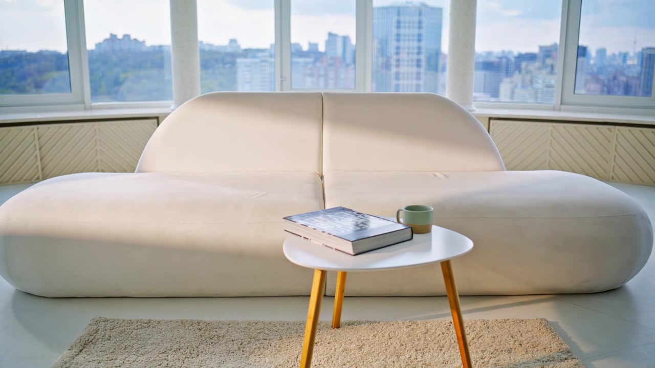Modern living room interior white sofa. Cozy apartment panoramic city view.