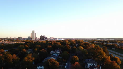 aerial dolly shot of the skyline of downtown georgia with stunning autumnal trees