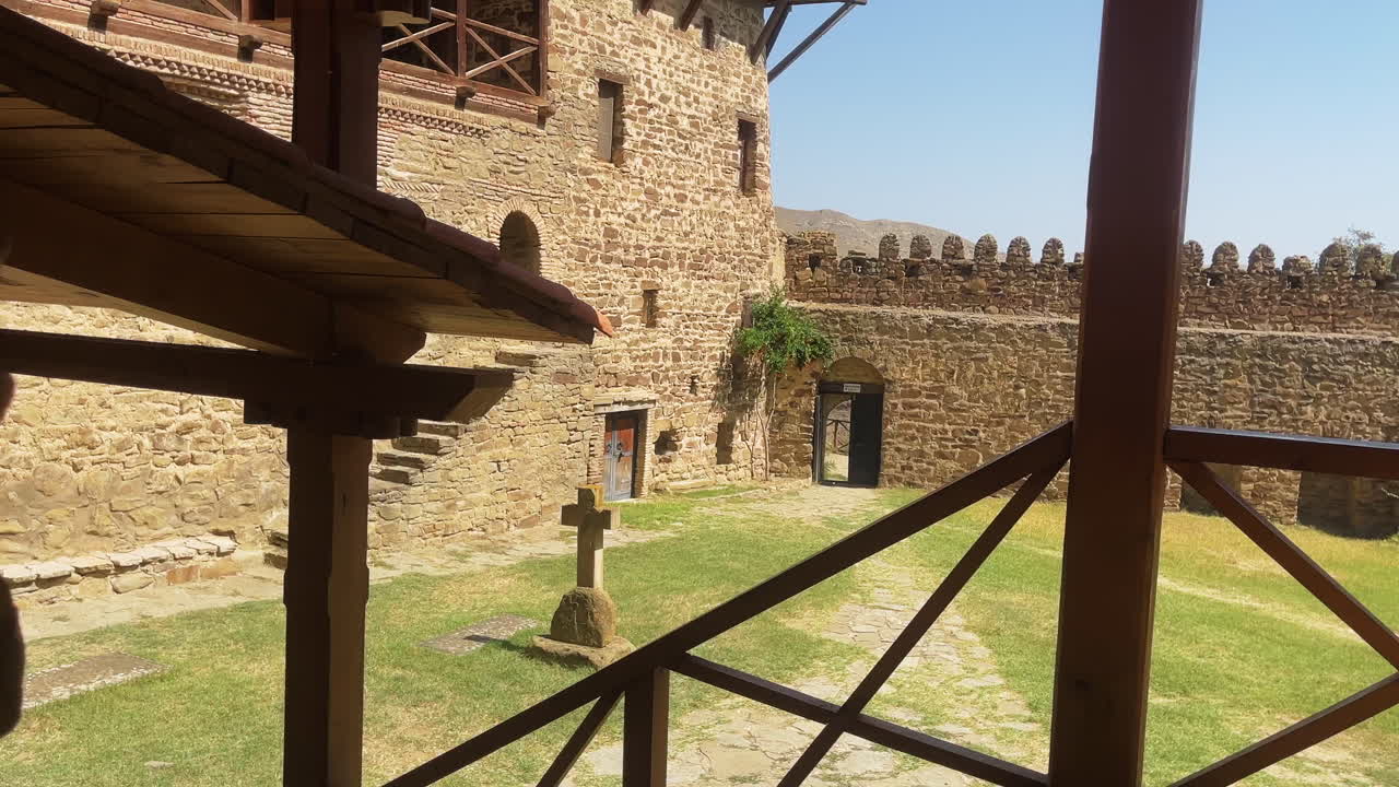 Davit Gareja, Georgia, Courtyard view of the ancient rock-hewn monastery complex. Reveals historic stone architecture, evoking a sense of spiritual and cultural heritage