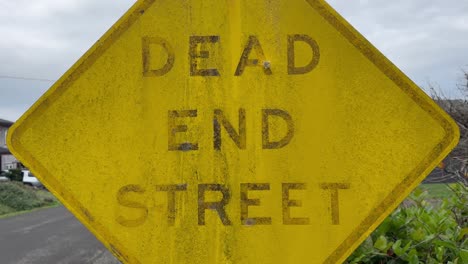 close up - weathered dead end signpost