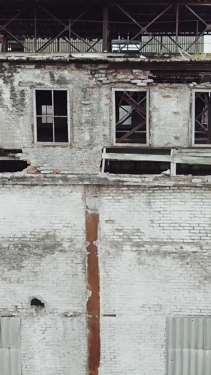 Destroyed factory after the bombing of the city of Donetsk Ukraine. Vertical video
