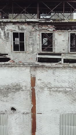 destroyed factory after the bombing of the city of donetsk ukraine. vertical video