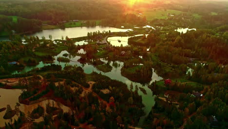 aerial drone shot over beautiful cottages beside small