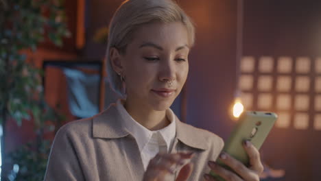 woman paying online with credit card and mobile phone