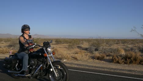 woman motorcyclist with dog