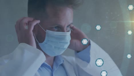 animation of caucasian male doctor with face mask and data processing with icons