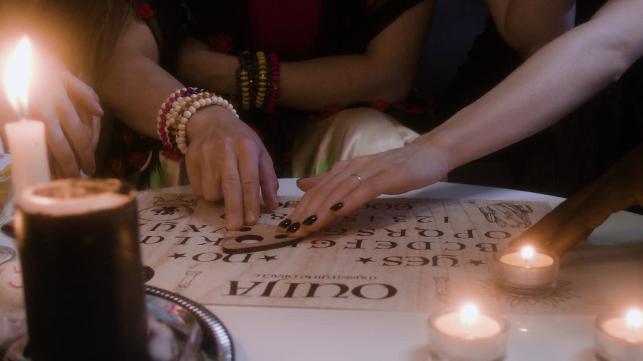 Ouija Board Séance with Candles