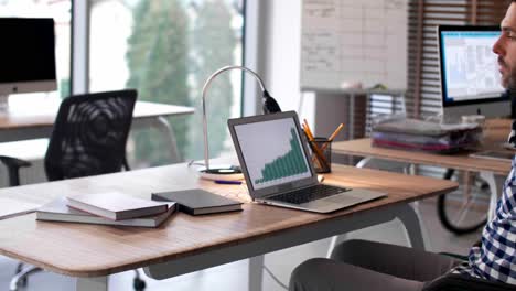 Man-in-a-wheelchair-using-laptop-in-office