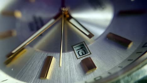 extreme close-up view of men‘s wristwatch mechanical clock