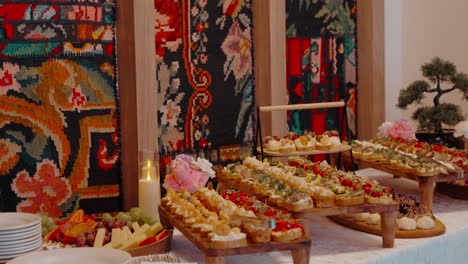 moldovan culinary delights: traditional appetizer spread against vibrant folk carpets in ethnic restaurant