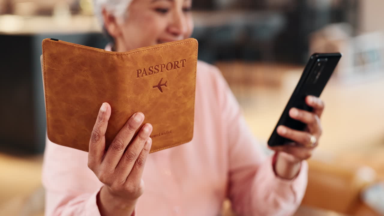 Woman holding passport and using a mobile phone