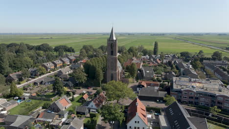 flying up to church in small, rural town in summer