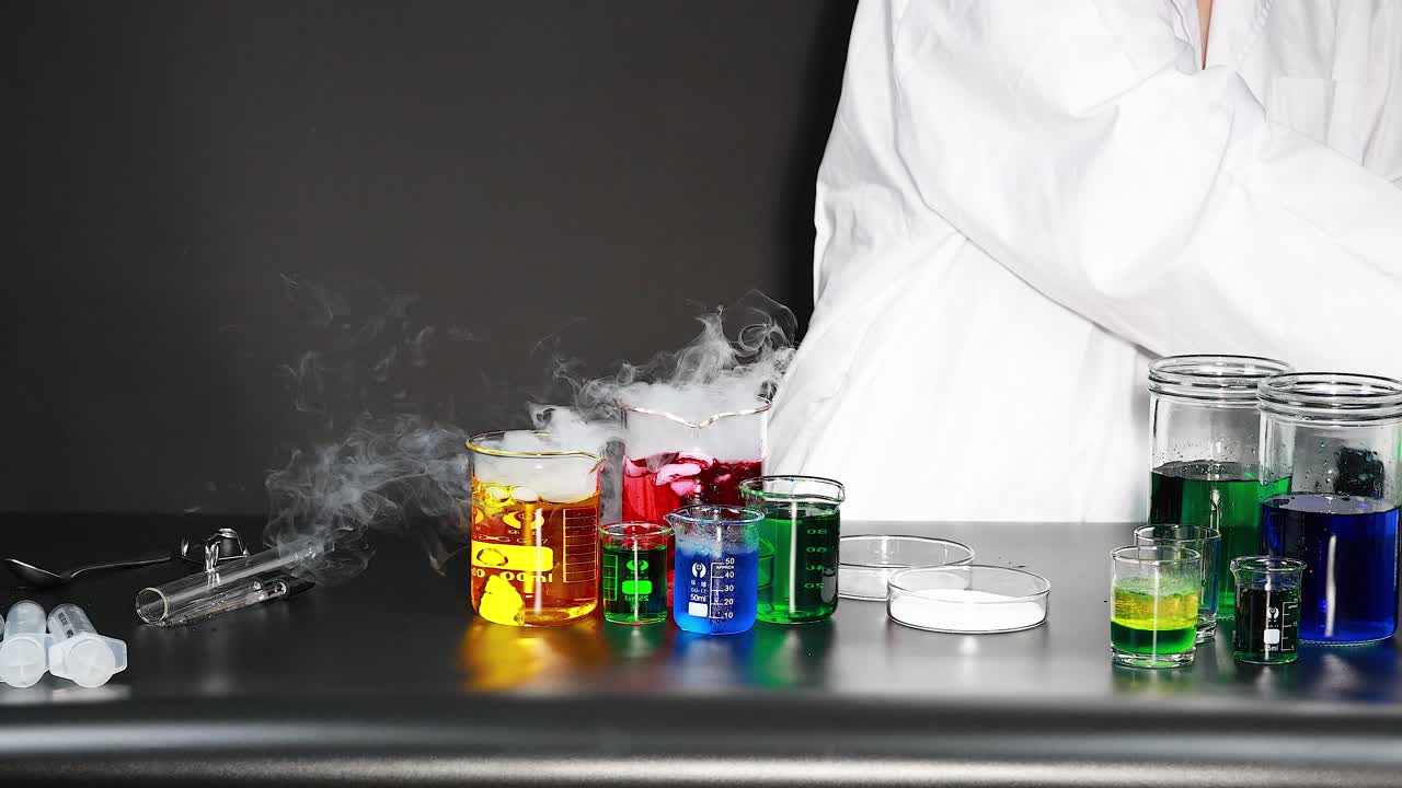 Scientist conducting experiment with colorful chemicals