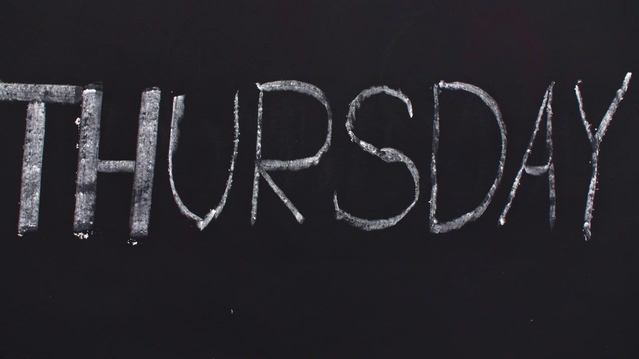 Word 'thursday' written on the blackboard