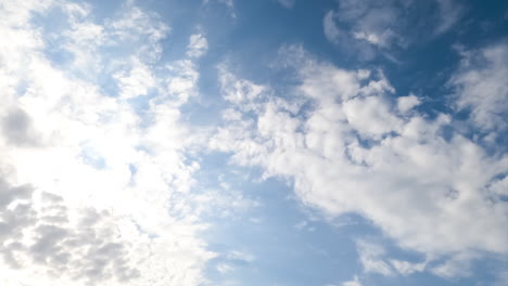 slow transformation of spindrift clouds in the atmosphere. white clouds covering the skies low angle view. timelapse.