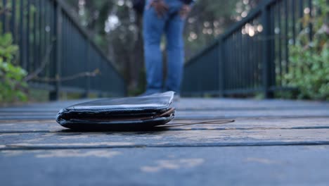 lost wallet on a wooden bridge