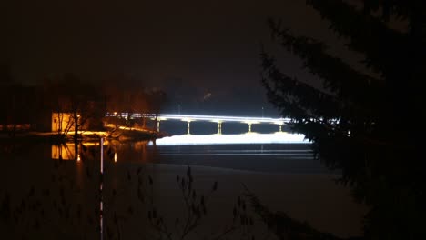 bright garlands on traffic bridge at night