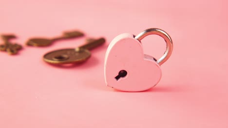 heart lock and keys on pink background