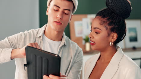 business colleagues working together on a tablet in the office