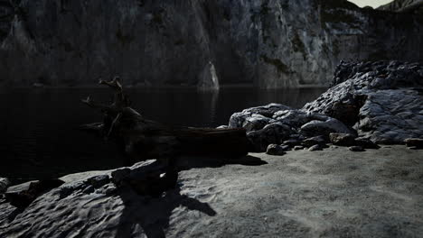 Black-sand-beach-hidden-between-blurred-volcanic-rocks