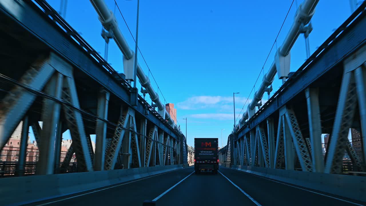 New York, USA, 5 August 2025: Perspective view through the steel cables of Manhattan Bridge
