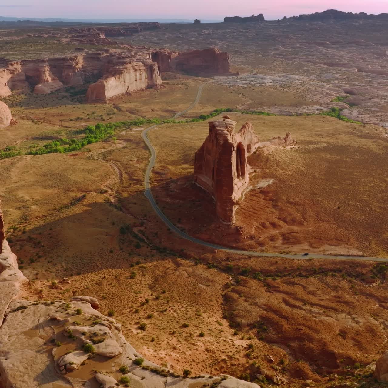 Diverse shapes of rocks in the dry desert of Utah, United States. Highway passing through the most interesting canyons in national park