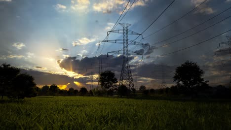 power lines at sunset over a field