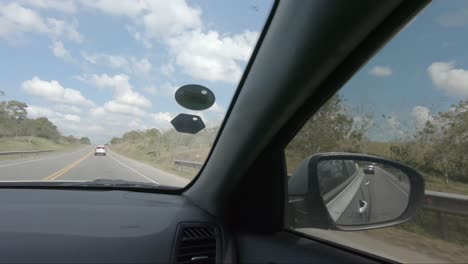 view from inside a car on a highway on a sunny day