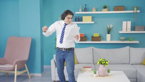 Funny-dancing-business-person-looking-at-paperwork-at-home.