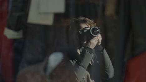 woman taking photo in a store