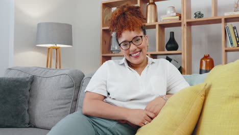 Face,-black-woman-and-smile-on-sofa-in-living