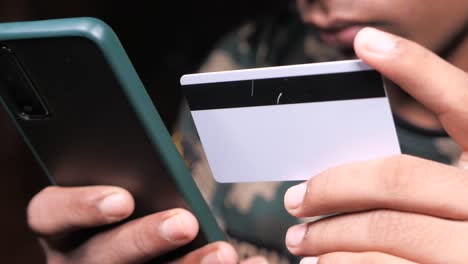 person using smartphone and credit card for online payment