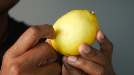 person holding a lemon