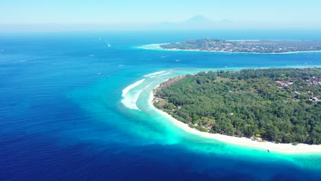 tropical-island-with-palm-trees-and-white-beach,-Indonesia-sea-with-turquoise-crystal-clear-seawater-on-misty-day