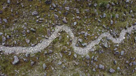 overhead view of a rocky trail on the mountains at huaraz trek in peru. aerial drone shot