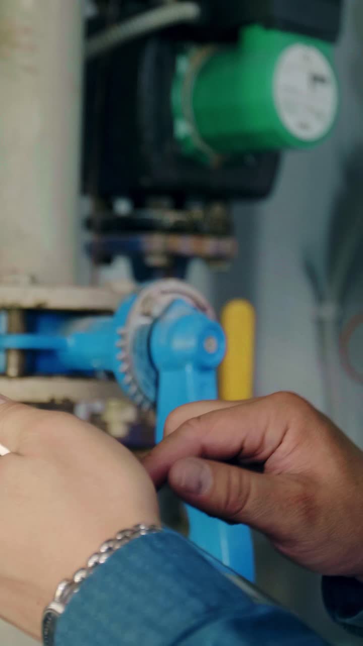 Technician Inspecting Industrial Equipment with Tablet