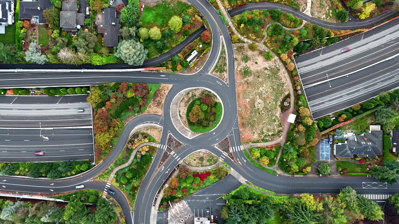 Cars swirl above and below in timelapse over Seattle’s autumn freeway network