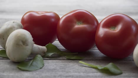 Red-fresh-organic-tomato,-4K-2160p-25fps-UHD-video---Slowly-panning-on-tomatoes-and-mushrooms-vegetable-food-background-4K-3840X2160-UltraHD-footage