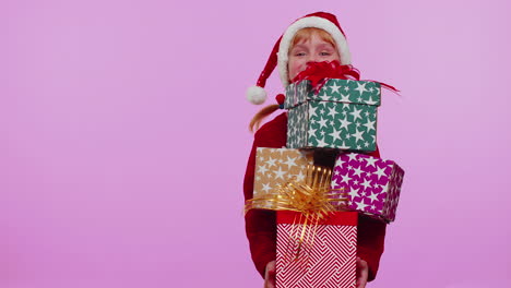 Girl-in-Christmas-sweater,-Santa-hat,-smiling,-holding-many-gift-boxes-New-Year-presents-shopping