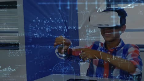 Mathematical-equations-floating-against-african-american-boy-wearing-vr-headset-at-elementary-school