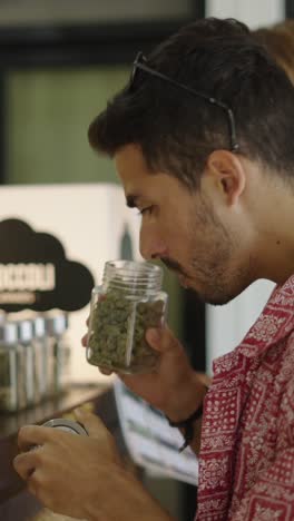 man smelling cannabis