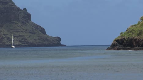 Small-sailboat-in-Comptroller-Bay,-Nuku-Hiva,-Marquesas-Islands,-French-Polynesia