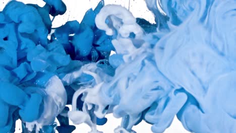 white and blue ink in water
