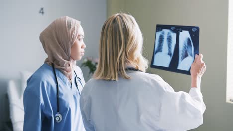 Two-female-doctors-discussing-x-rays-4k