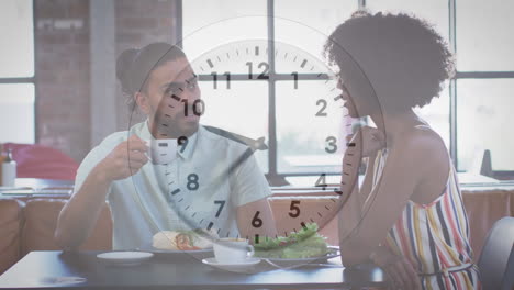 video of clock over diverse man and woman in restaurant