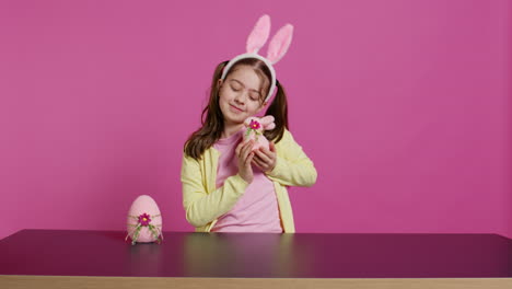 Delighted-little-girl-playing-around-with-lovely-easter-decorations