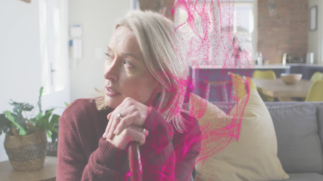 Mature woman gripping cane, magenta health overlay drifting in, sitting up, looking left reflecting