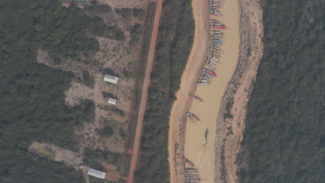 wide aerial of boats parked on tonle sap river