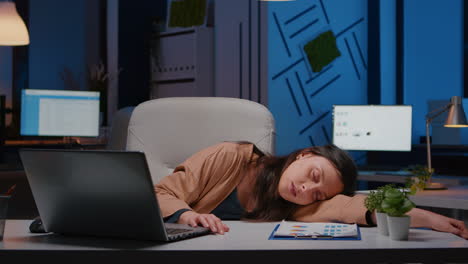 businesswoman sleeping while working at accounting statistics in company office