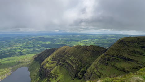 mountain summit ridge panoramic view over lush green farm landscape